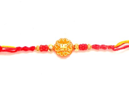 Swastik rakhi in orange and gold Online