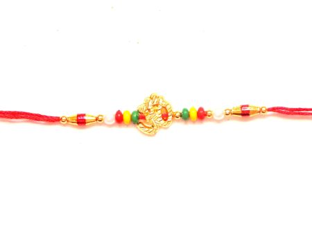 Om Rakhi in gold with beads Online